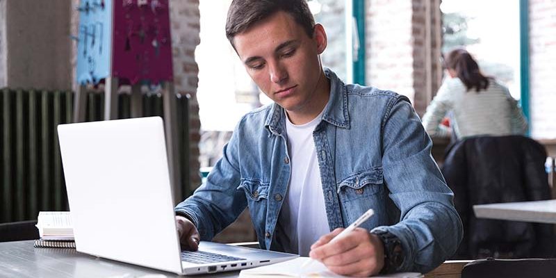 College student writing an essay