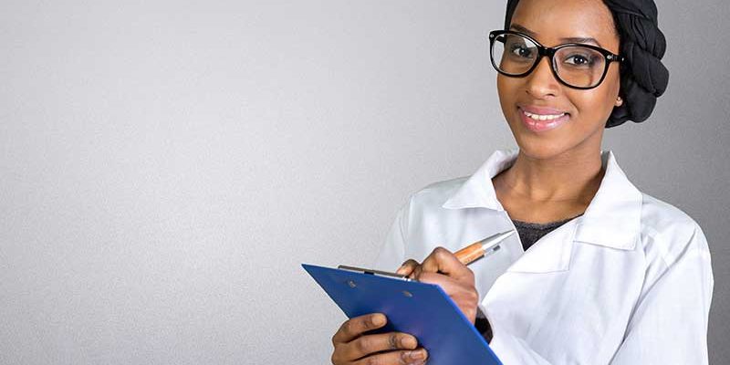 Nursing student holding a chart