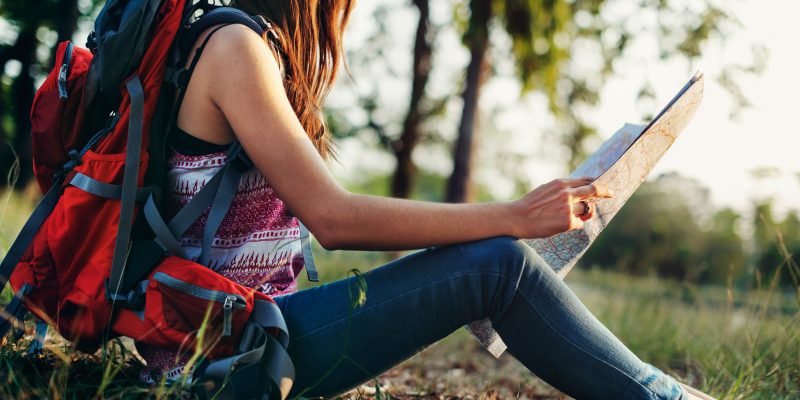 College student looking at a map