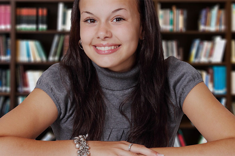 Happy student at the library
